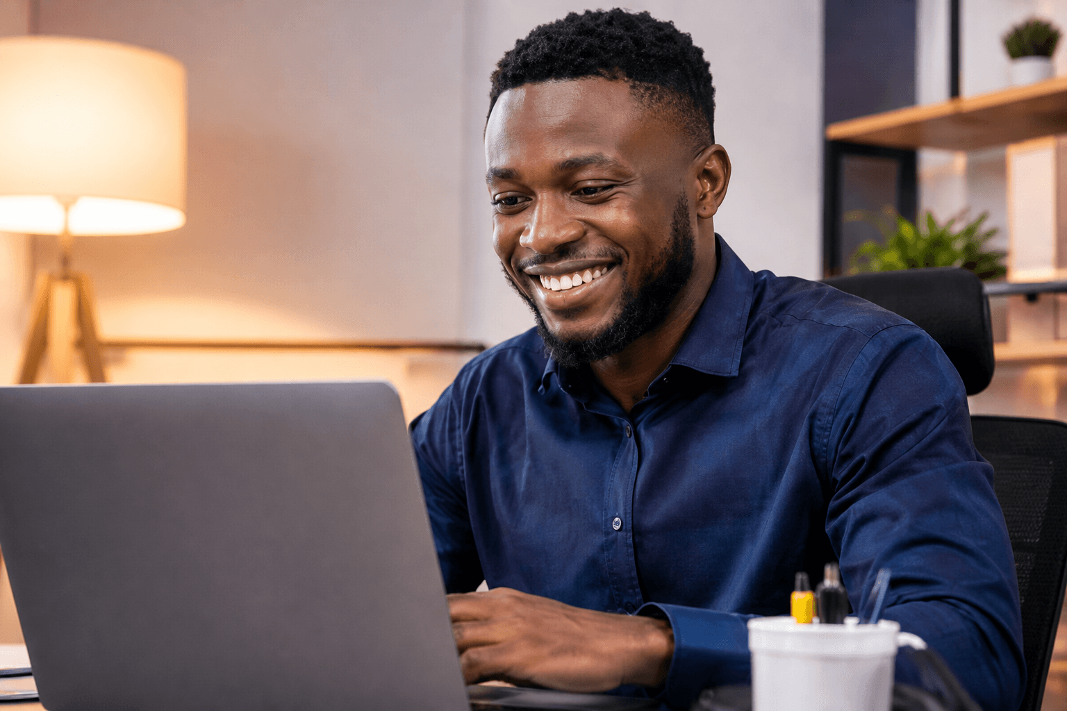 Professional using a laptop in an office