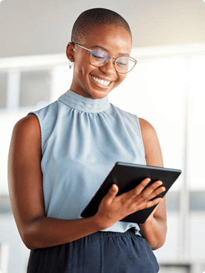 Smiling professional reviewing information on a tablet